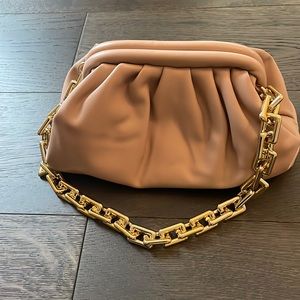 Bottega Veneta inspired clutch with shoulder strap. Great neutral bag.